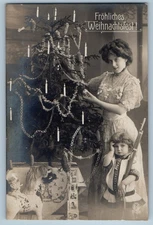 c1910's Christmas Mother And Little Girl With Gun Horse Toy Antique Postcard