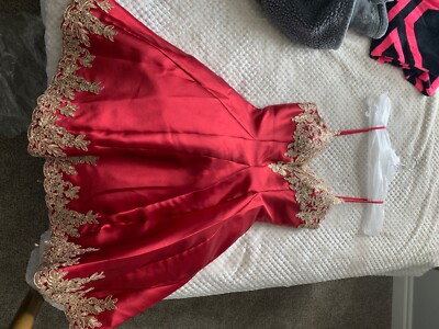 S/M may queen dress , red w/gold details, pockets, about above knee length