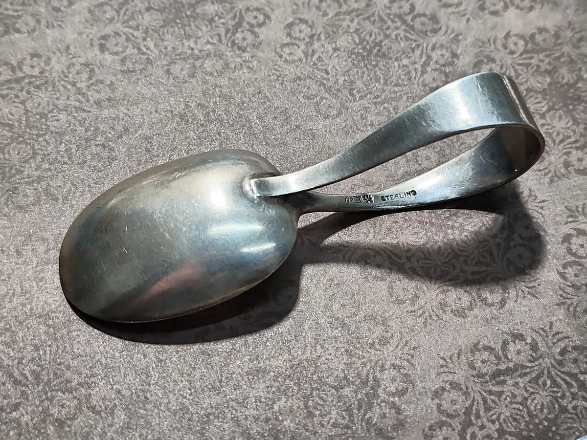 Loop baby spoon in sterling silver.