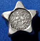 A MK Barz Poured Silver Star 0.75 Ozt .999 Fine. Star Shaped With Skull. COA