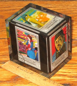 LUCITE PAPERWEIGHT CUBE WITH 6 GAUGUIN STAMPS
