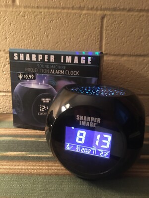 Sharper Image alarm clock - Star Projection, digital display, sounds, Battery Op