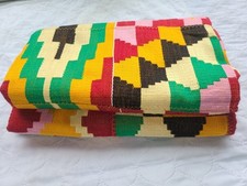 A beautiful vibrant 2 yards Ghanaian Kente handwoven with traditional patterns.