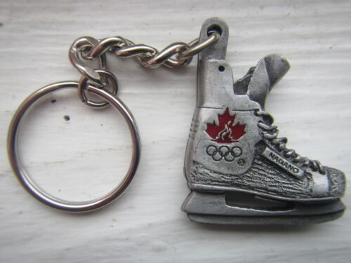 Llavero llavero de recuerdo con logotipo del equipo olímpico canadiense de hockey Nagano Japón 1998 - Imagen 1 de 4