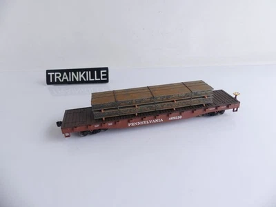 (1) EVEMODEL HO WAGON PLAT A BOGIES TYPE US + CHARGEMENT DE POUTRES - Photo 1/2