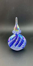 blue and white feathered perfume bottle with stopper
