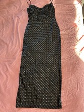 Striking bodycon midi dress featuring a metallic, 3D-effect geometric pattern.