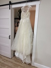 Brand new wedding dress size 10, never been worn with tags