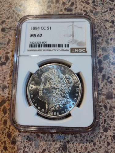 1884-CC $1 Morgan Dollar NGC MS62 below market mirror background beautiful coin