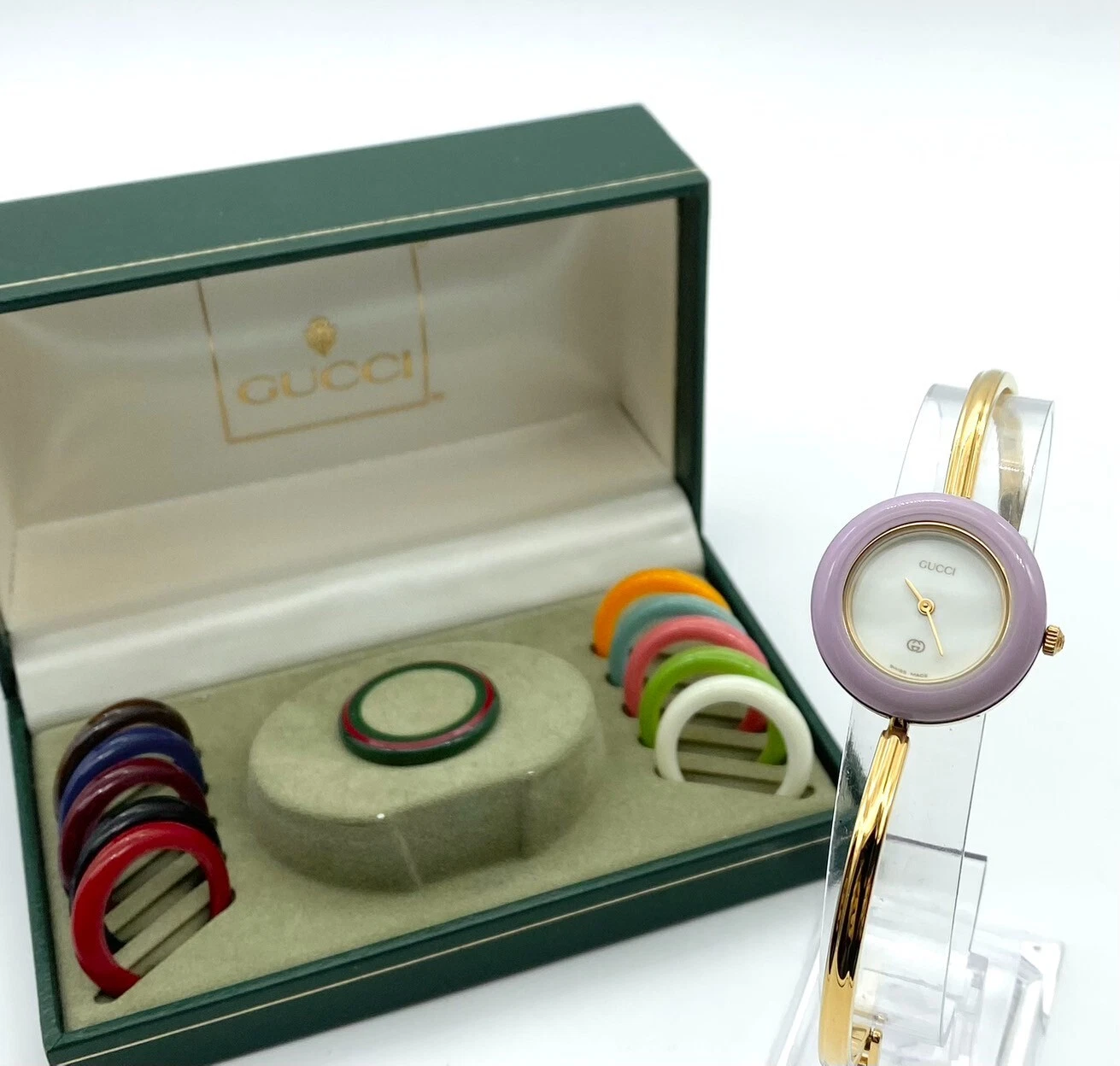 Montre femme Gucci lunette changeante 12 couleurs cadran doré en boîte fonctionne en stock