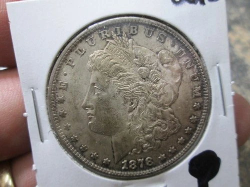 US 1878 REV OF 79 7 TAIL FEATHERS MORGAN DOLLAR COIN IN UNCIRCULATED CONDITION