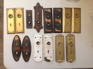 Fourteen Doorknob Backplates Six Matched Pair Two Singles Tin & Cast Iron