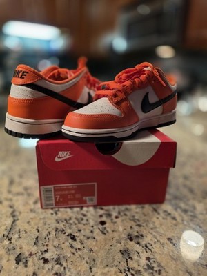 Nike Dunk Low GS ''Halloween 2022''sneaker in a white, orange, and black colorway.