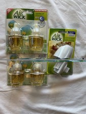 4 refills plus 1 warmer Air Wick scented oil ...