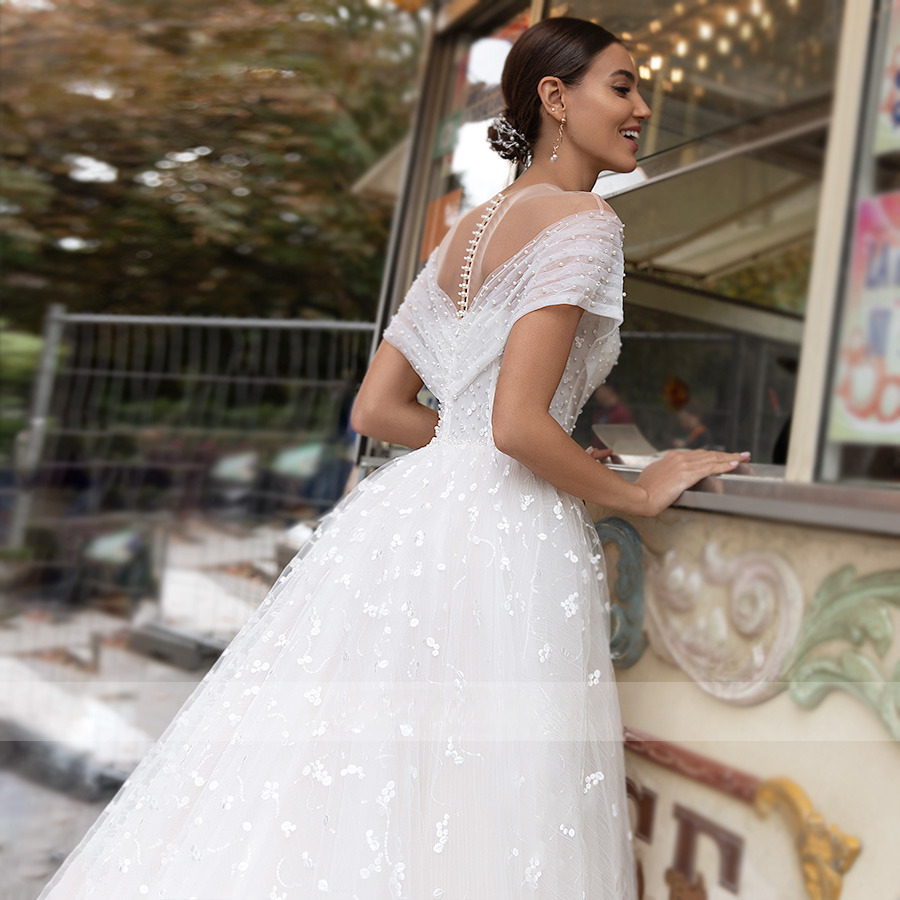 A-line Wedding Dresses Illusion Point Wave Lace Pearls Off