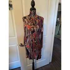 Free People turtleneck dress, cutout back,  long sleeves with ties on sleeves.