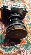 vintage Voigtländer Zoomar 36-82mm f/2.8 lens attached to an Exakta SLR camera