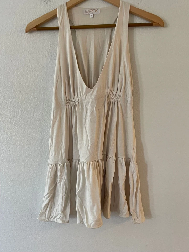 Blusa sin mangas con cuello en V acanalado La ROK talla XS espalda deportiva volantes dobladillo sin mangas Foto 2 de 4