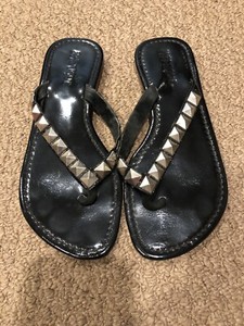 black patent leather flip flops
