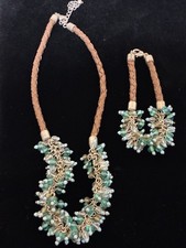 Beaded Necklace And Bracelet Set With Turquoise Colored Beads On A Braided Cord