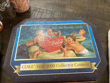 2000 coke cola tin with 35mm camera never opened good condition