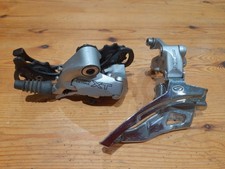 SHIMANO DEORE XT front and rear derailleurs.