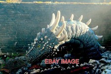 PHOTO  CAERPHILLY CASTLE . A FULLY GROWN WELSH DRAGON IN ITS DEN KEEPING A CLOSE