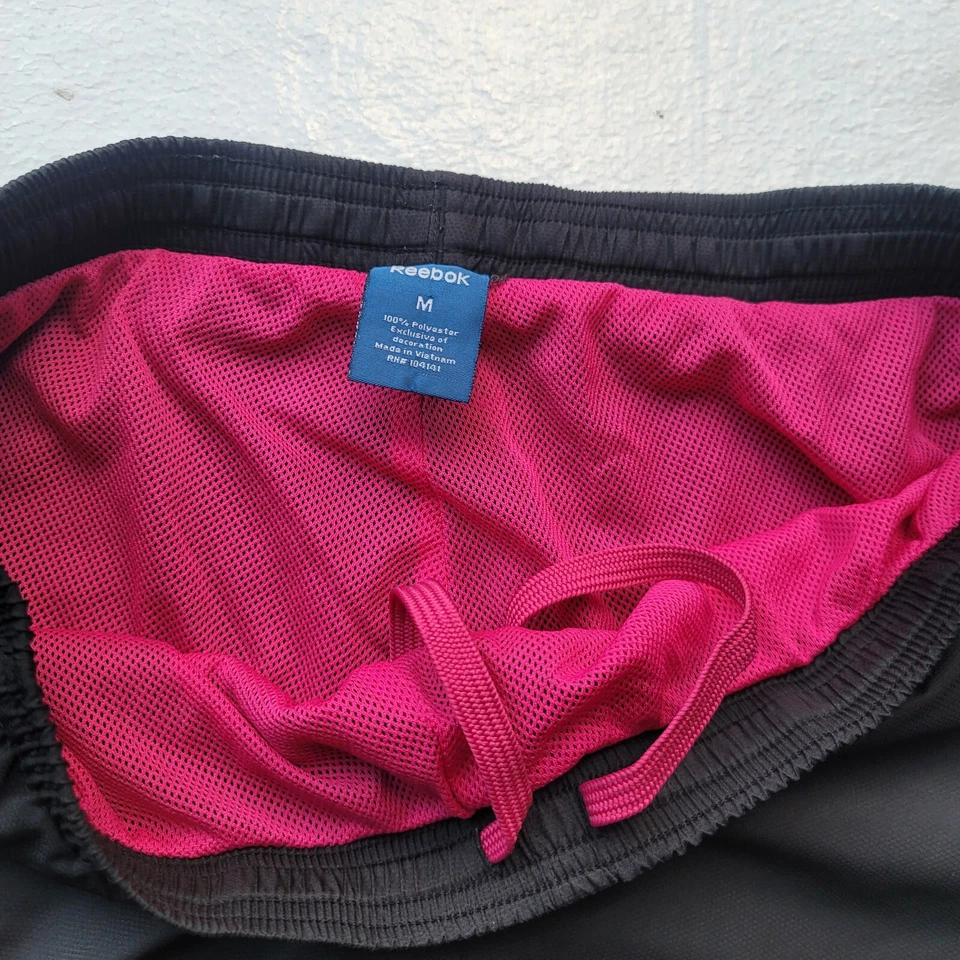 Pantalones para mujer Reebok cortavientos atléticos pista negro rosa forrados talla mediana Foto 2 de 4