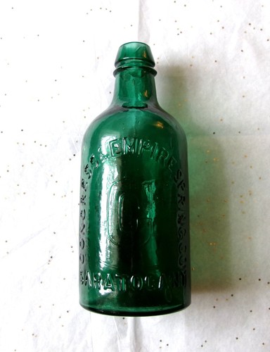 7 1/2-inch-tall Teal Congress & Empire Springs Co. Bottle