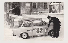 Man Poses by the East German Racing Pride Trabant Snapshot Abstract Unusual