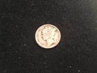 A 1919 Mercury Dime In VG+.