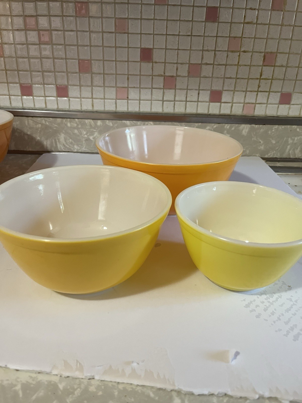 Set of three vintage Pyrex Daisy Citrus orange and yellow mixing bowls