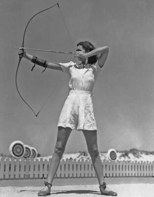 Female archer takes aim, circa 1945 Old Historic Photo