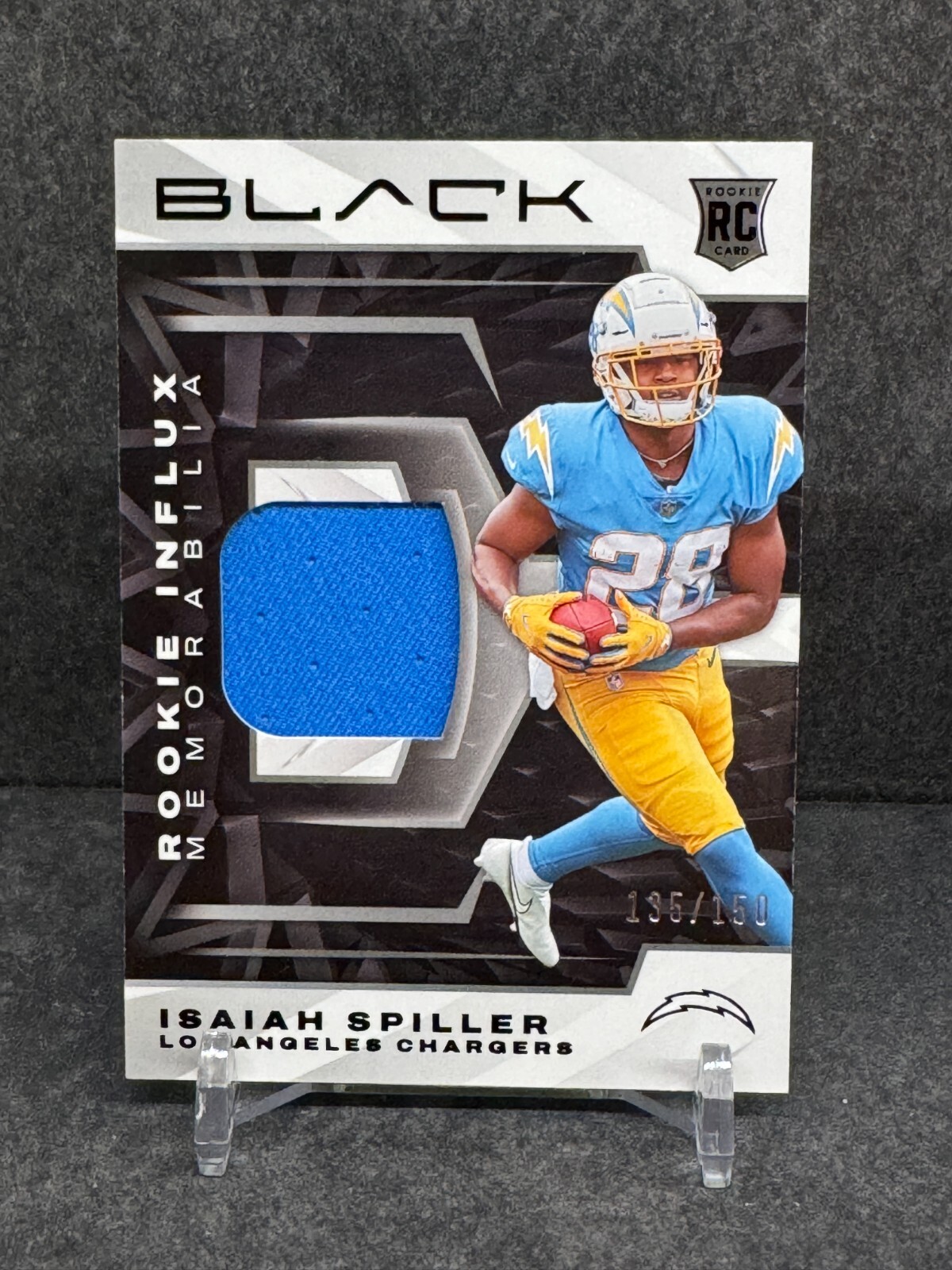 Isaiah Spiller 2022 Panini Black Rookie Influx Memorabilia #RIM-ISP RC /150