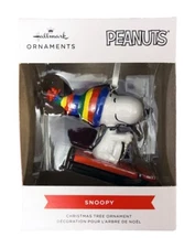 PEANUTS SNOOPY WITH RAINBOW HAT SLED RIDING ORNAMENT BY HALLMARK, 2021