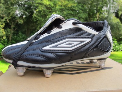 black and gold kids football boots