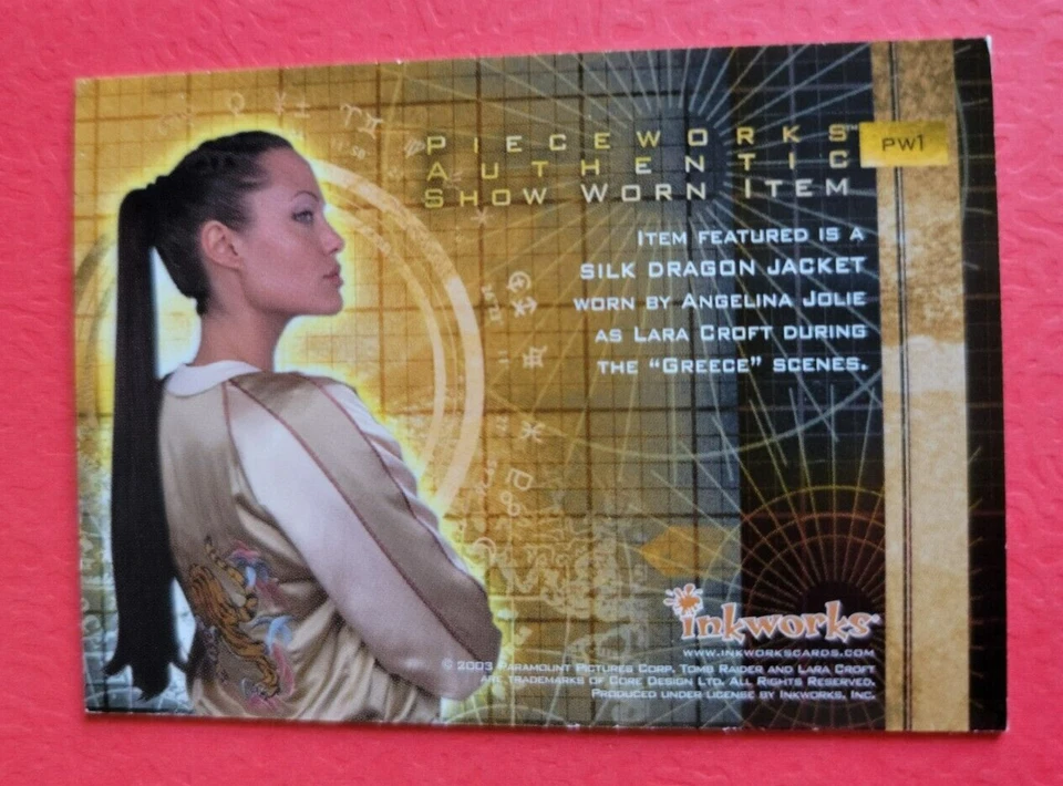 ANGELINA JOLIE TOMB RAIDER LARA CROFT WORN SILK DRAGON JACKET PIECE RELIC CARD - Image 2 of 2