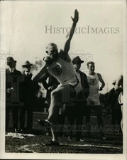 1928 Press Photo Shot putter at a track meet takes a practice swing - net11400