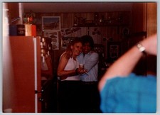 Vtg Color Snapshot Smiling Couple Hugging In Wood Paneled Kitchen Home 1990s