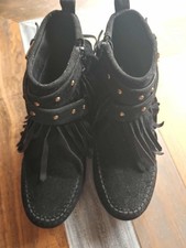Ankle booties with a moccasin-style stitched round toe