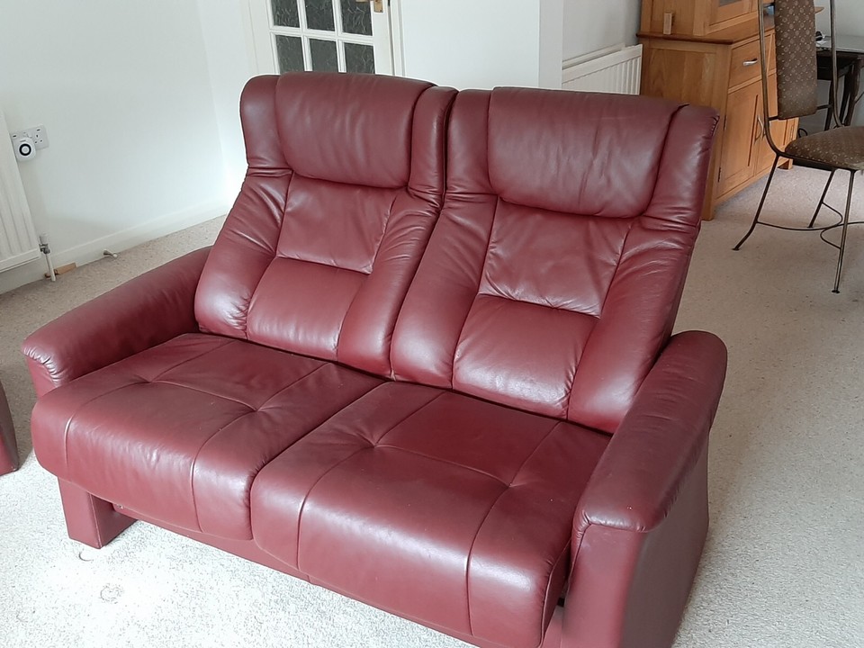 2 seater leather reclining sofa and armchair, with footstool. High