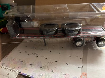 1/32 NEW RAY  BLACK FLATBED W /BIG TIRES, NO PACKAGING  # C131