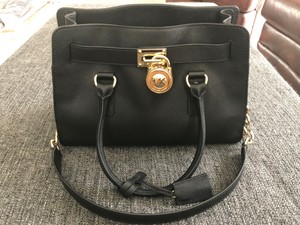 michael kors black purse with gold lock
