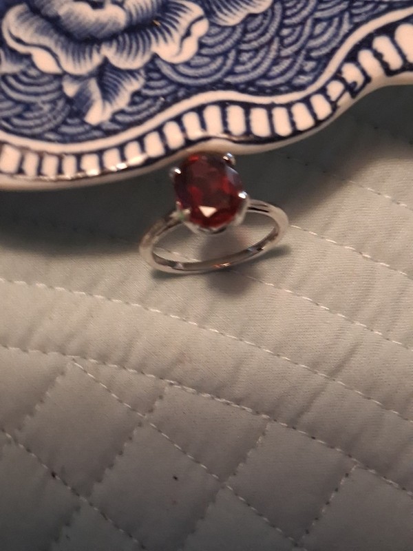 STERLING  GARNET SOLITAIRE RING. ALL GOOD NO SCRATCHES. MARKED 925  SZ 6 1/2