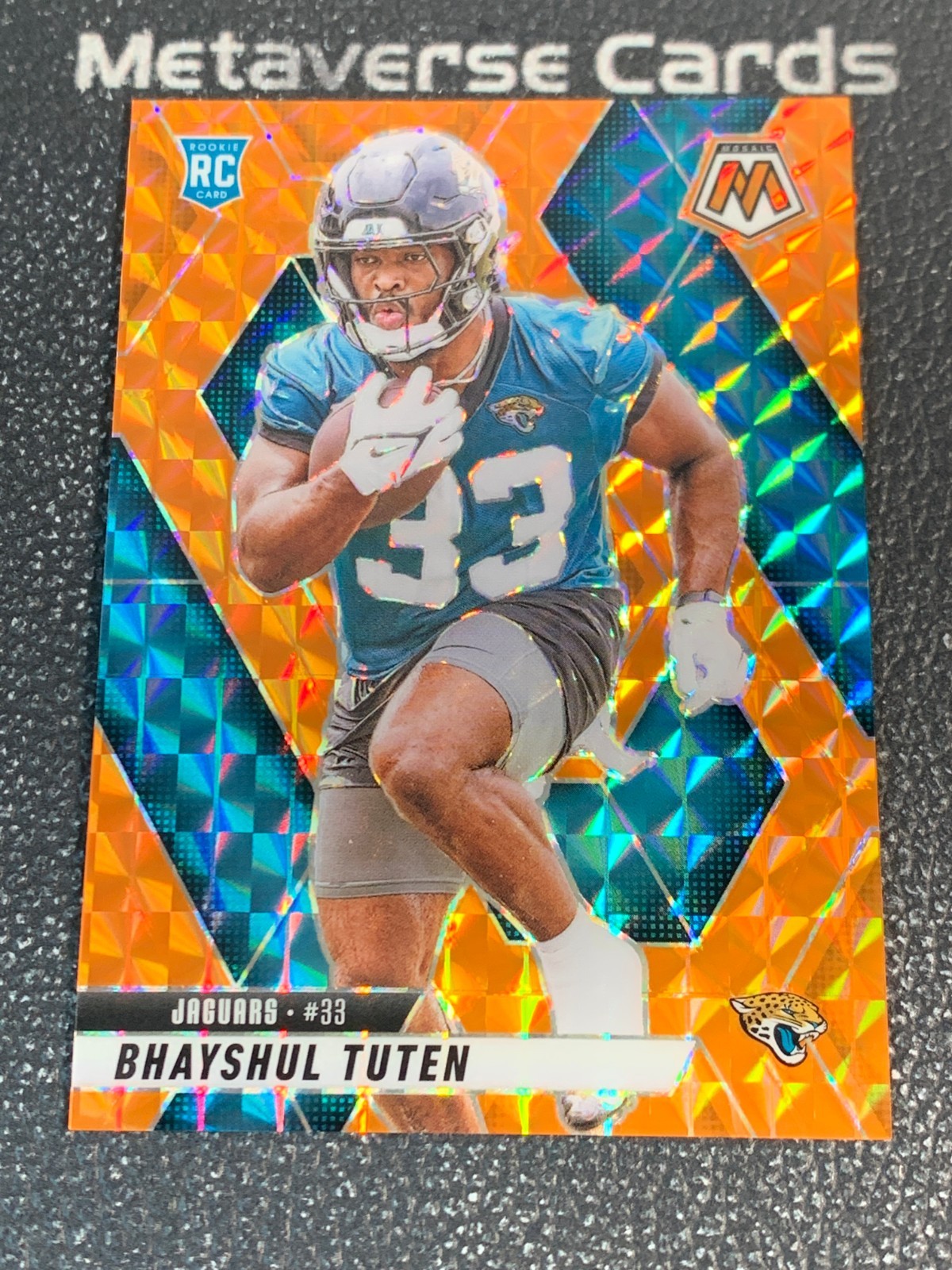 2025 Panini Mosaic Rookie Orange Prizm #385 RC Bhayshul Tuten 035/199 Jaguars