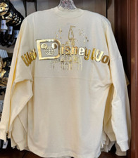 Walt Disney World SPIRIT JERSEY, BN SIZE L, CREAM & GOLD PIXIE DUST CASTLE TOP
