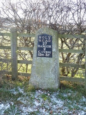 Photo A3 A Telford milestone (Holyhead 27) on a de-trunked section of th c2010