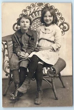 POSTCARD RPPC Siblings in Studio Decorative Chair c1920 Hair Cuts