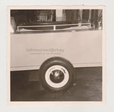 Photographer's Flash Reflects Off the New Van's Hubcap Unusual Snapshot Photo