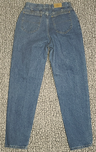 Light blue high-waisted L.L.Bean mom jeans with back pocket stitching and tan leather L.L.Bean patch on waistband.